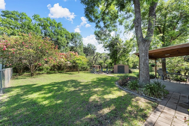 5819 Fairview Dr, Waco, TX 76710 - fenced backyard with a storage unit and a patio area