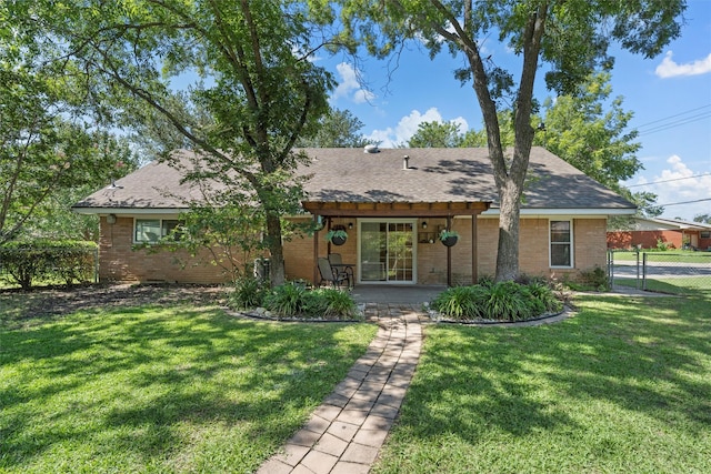 5819 Fairview Dr, Waco, TX 76710 - rear view of property featuring brick siding and roof with shingles