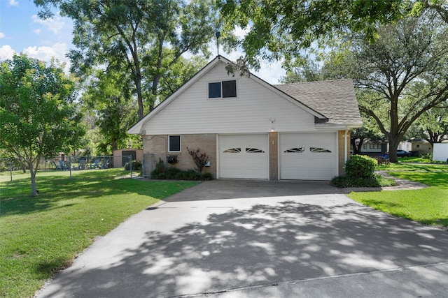 5819 Fairview Dr, Waco, TX 76710 - view of front of house featuring brick siding, roof with shingles, driveway, and an attached garage