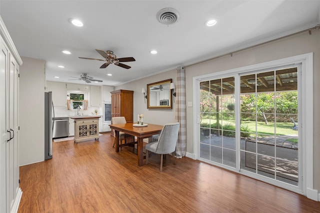 5819 Fairview Dr, Waco, TX 76710 - dining area with recessed lighting, ceiling fan, light wood finished floors, and ornamental molding