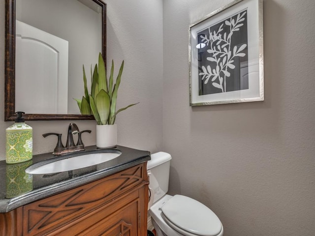 1901 Desoto Dr, Mckinney, TX 75072 - half bathroom featuring vanity and toilet