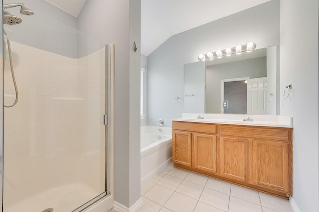 3016 Bryce Dr, Wylie, TX 75098 - bathroom with a shower stall, tile patterned flooring, a bath, double vanity, and lofted ceiling