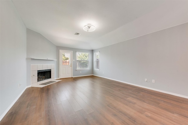 3016 Bryce Dr, Wylie, TX 75098 - unfurnished living room featuring a fireplace and wood finished floors