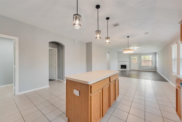 3016 Bryce Dr, Wylie, TX 75098 - kitchen with arched walkways, light tile patterned floors, and open floor plan