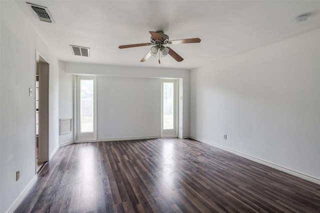 224 Iberis Dr, Arlington, TX 76018 - empty room featuring a smoke detector, healthy amount of natural light, dark wood-style flooring, and ceiling fan