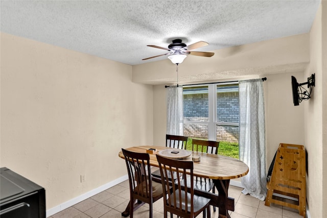 7612 Creekmoore Dr, Fort Worth, TX 76133 - dining area with ceiling fan, light tile patterned flooring, and a textured ceiling