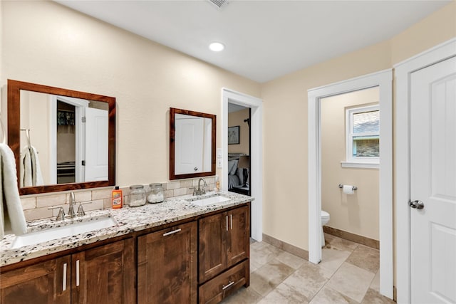 7612 Creekmoore Dr, Fort Worth, TX 76133 - full bathroom featuring double vanity, a closet, and tasteful backsplash