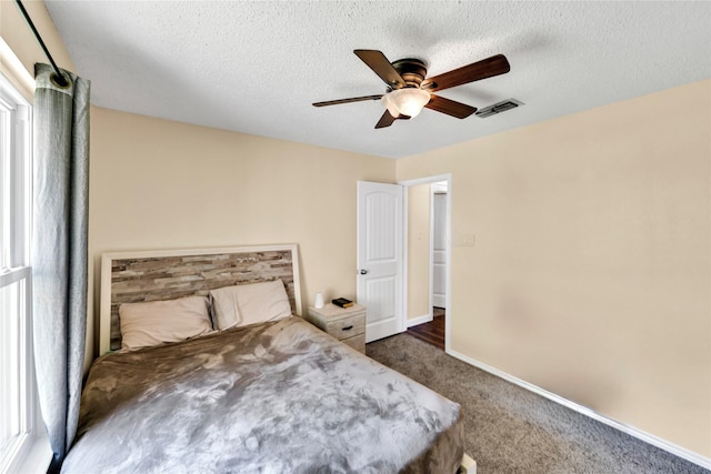 7612 Creekmoore Dr, Fort Worth, TX 76133 - carpeted bedroom featuring ceiling fan and a textured ceiling