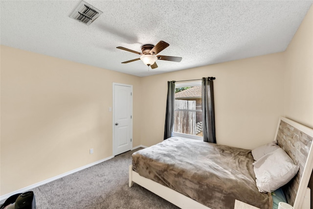 7612 Creekmoore Dr, Fort Worth, TX 76133 - carpeted bedroom with a textured ceiling and a ceiling fan