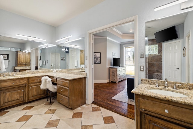 1212 Chandler Cir, Prosper, TX 75078 - bathroom featuring vanity, crown molding, tiled shower, and tile patterned flooring