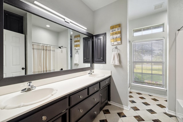 1212 Chandler Cir, Prosper, TX 75078 - bathroom featuring double vanity and a shower with shower curtain