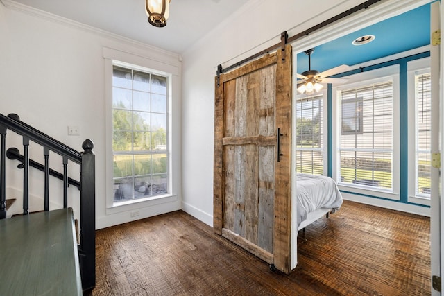 1212 Chandler Cir, Prosper, TX 75078 - foyer entrance with a barn door, plenty of natural light, crown molding, ceiling fan, and stairs