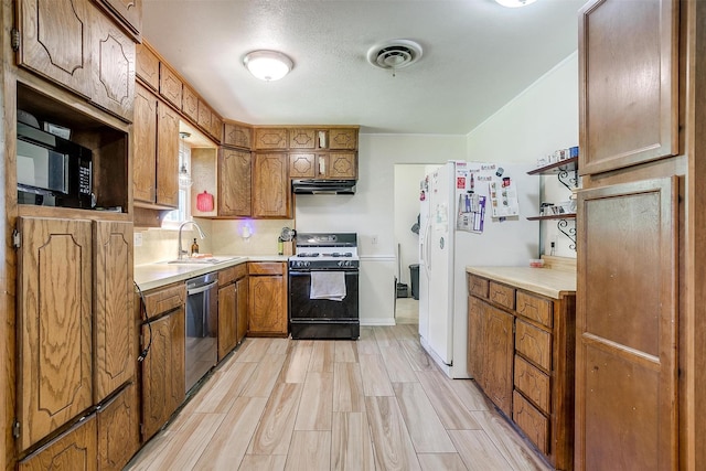 2805 Sadler Ave, Fort Worth, TX 76133 - kitchen with gas stove, stainless steel dishwasher, white refrigerator with ice dispenser, and brown cabinetry