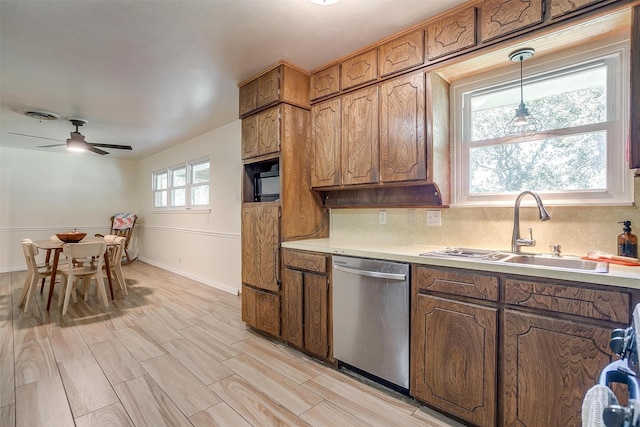 2805 Sadler Ave, Fort Worth, TX 76133 - kitchen featuring dishwasher, light countertops, ceiling fan, and brown cabinetry
