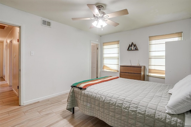 2805 Sadler Ave, Fort Worth, TX 76133 - bedroom with light wood-style flooring, multiple windows, attic access, and ceiling fan