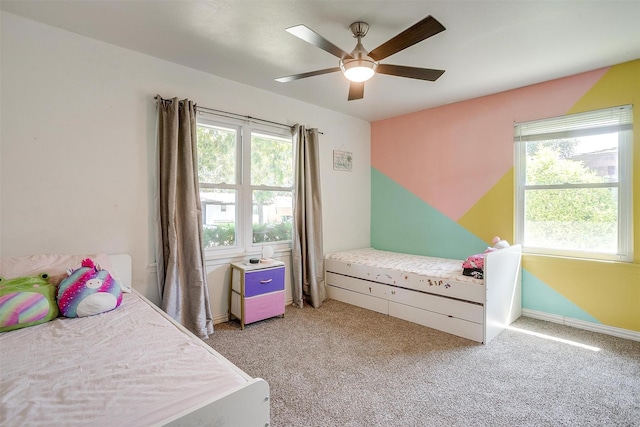 2805 Sadler Ave, Fort Worth, TX 76133 - bedroom with multiple windows, light carpet, and ceiling fan