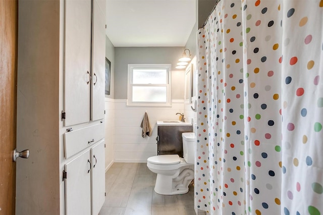 2805 Sadler Ave, Fort Worth, TX 76133 - bathroom featuring wainscoting, tile patterned flooring, curtained shower, and vanity