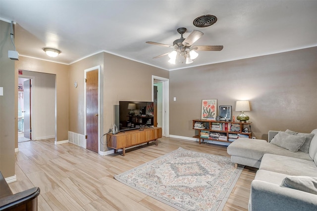 2805 Sadler Ave, Fort Worth, TX 76133 - living room featuring a ceiling fan, crown molding, and light wood-style floors