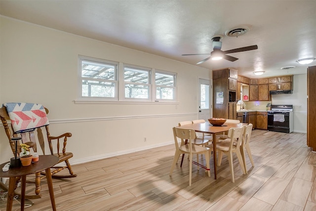2805 Sadler Ave, Fort Worth, TX 76133 - dining room featuring ceiling fan and light wood-style floors