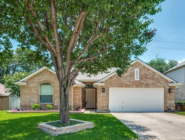 920 Park Forest Dr, Hurst, TX 76053 - view of front of house with brick siding, an attached garage, and driveway