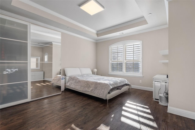 8538 Church St, Frisco, TX 75034 - bedroom with a raised ceiling, wood finished floors, and ornamental molding