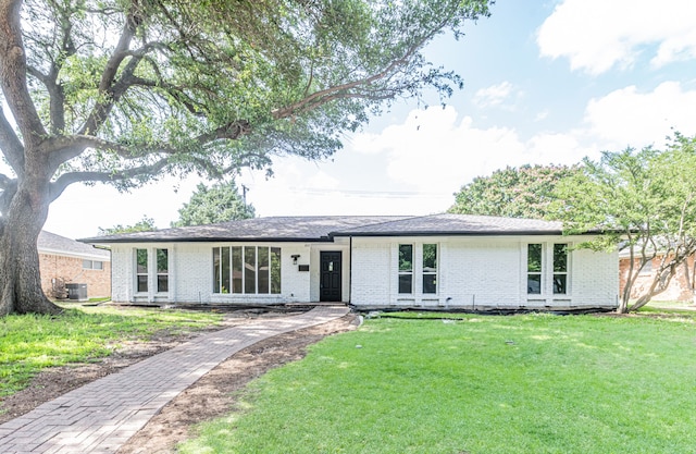 1517 Amherst Dr, Plano, TX 75075 - view of front of property featuring brick siding, a front lawn, and driveway