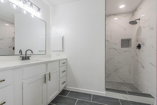 1517 Amherst Dr, Plano, TX 75075 - bathroom with vanity, tiled shower, and marble look tiles