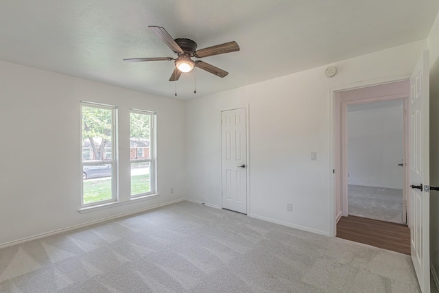 1517 Amherst Dr, Plano, TX 75075 - unfurnished room featuring a ceiling fan, light carpet, and a smoke detector