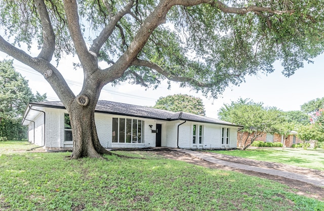 1517 Amherst Dr, Plano, TX 75075 - single story home with brick siding and a front lawn