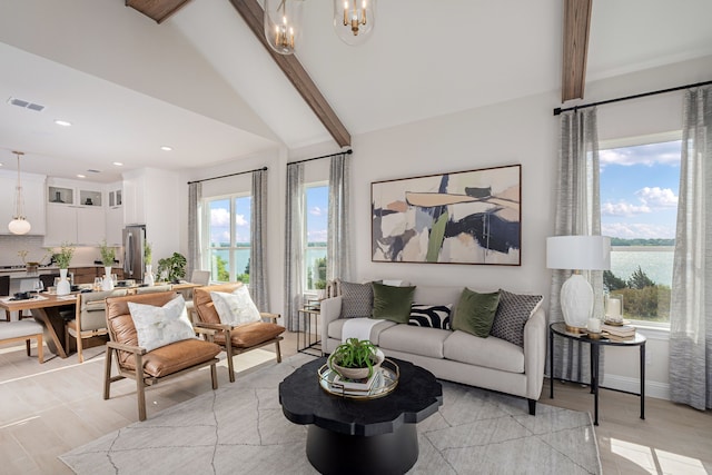2718 Sunrise Dr, Rowlett, TX 75089 - living room with a chandelier, light wood-style flooring, a water view, and recessed lighting