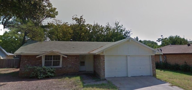 5410 Kings Manor Dr, Lake Dallas, TX 75065 - ranch-style home with a garage, concrete driveway, brick siding, and board and batten siding