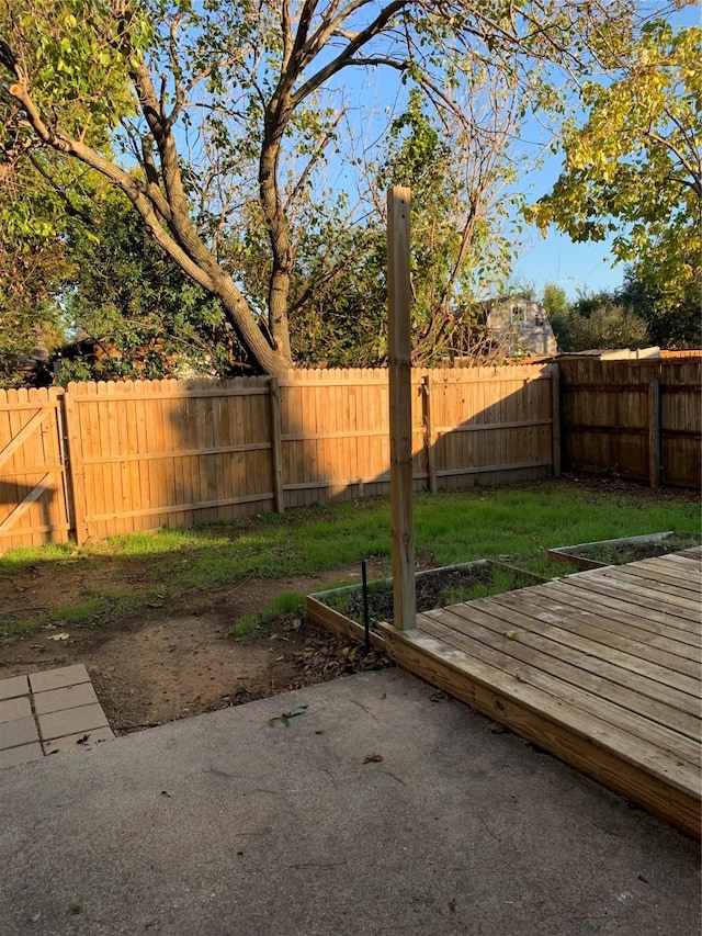 5410 Kings Manor Dr, Lake Dallas, TX 75065 - fenced backyard featuring a wooden deck and a patio area