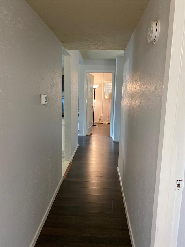 5410 Kings Manor Dr, Lake Dallas, TX 75065 - corridor featuring dark wood-style floors and a textured wall