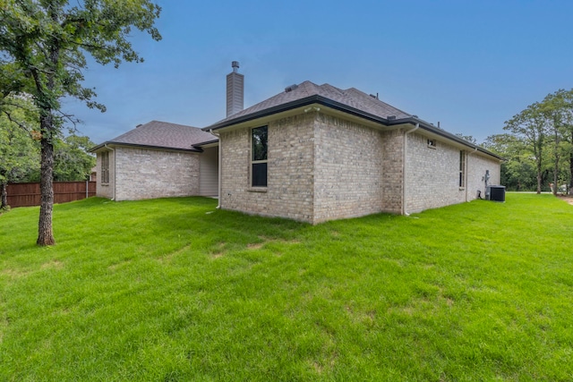 458 Jim Walters Dr, Runaway Bay, TX 76426 - back of property featuring a chimney and brick siding