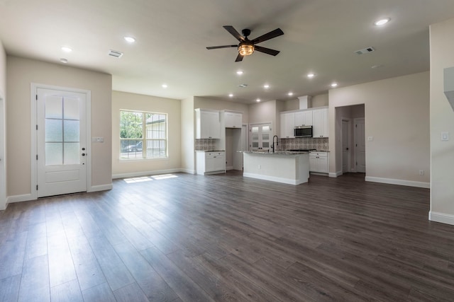 458 Jim Walters Dr, Runaway Bay, TX 76426 - unfurnished living room with a ceiling fan, dark wood-style flooring, and recessed lighting