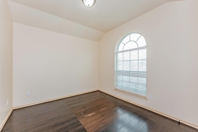 2230 Bridle Path Dr, Lancaster, TX 75146 - empty room featuring vaulted ceiling and dark wood-type flooring
