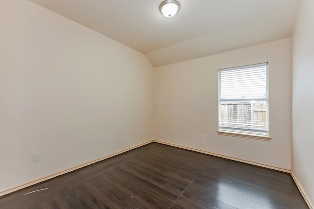 2230 Bridle Path Dr, Lancaster, TX 75146 - spare room with dark wood-style flooring and lofted ceiling