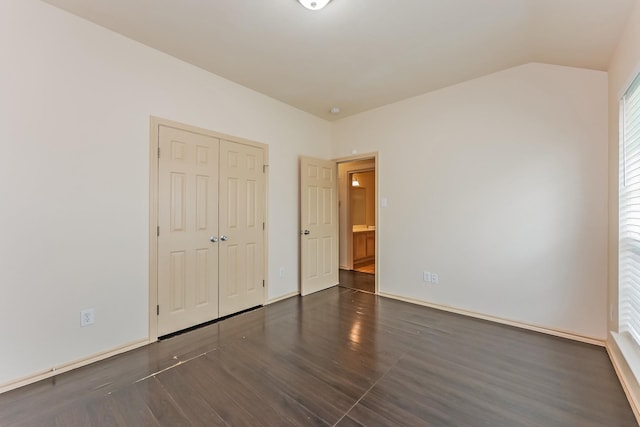2230 Bridle Path Dr, Lancaster, TX 75146 - unfurnished bedroom with wood finished floors, a closet, and vaulted ceiling