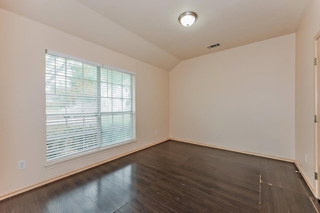 2230 Bridle Path Dr, Lancaster, TX 75146 - unfurnished room featuring lofted ceiling and dark wood finished floors