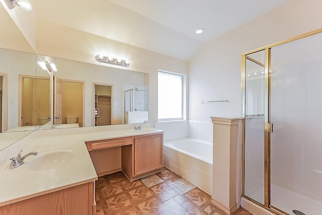 2230 Bridle Path Dr, Lancaster, TX 75146 - bathroom with a stall shower, a bath, double vanity, vaulted ceiling, and recessed lighting