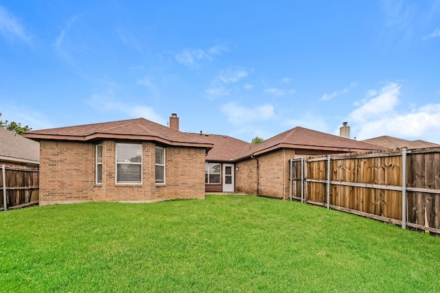 2230 Bridle Path Dr, Lancaster, TX 75146 - rear view of property with brick siding, a fenced backyard, a chimney, and roof with shingles