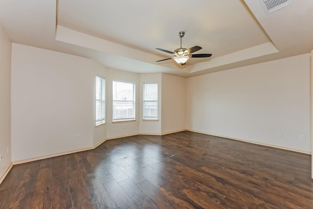 2230 Bridle Path Dr, Lancaster, TX 75146 - spare room featuring a raised ceiling, a ceiling fan, and wood finished floors
