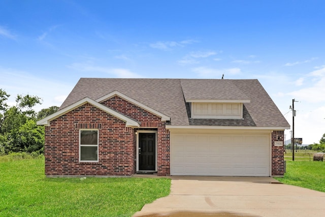 2906 Emma Ln, Mabank, TX 75147 - view of front of home featuring brick siding, driveway, a front lawn, a shingled roof, and an attached garage