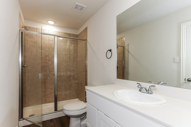 2906 Emma Ln, Mabank, TX 75147 - full bathroom featuring vanity, a shower stall, and wood finished floors