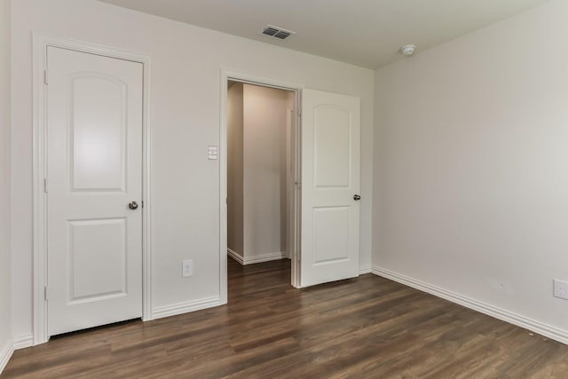 2906 Emma Ln, Mabank, TX 75147 - unfurnished bedroom featuring dark wood-type flooring