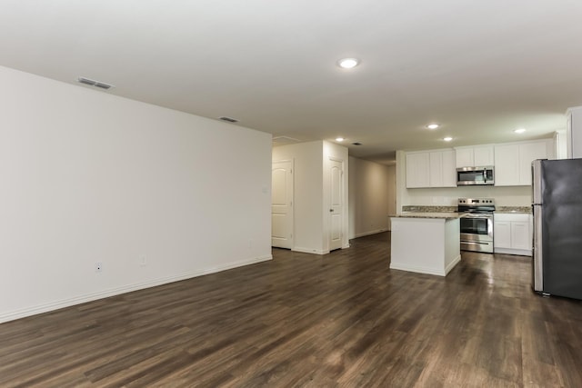 2906 Emma Ln, Mabank, TX 75147 - kitchen with stainless steel appliances, recessed lighting, a center island, open floor plan, and dark wood-type flooring