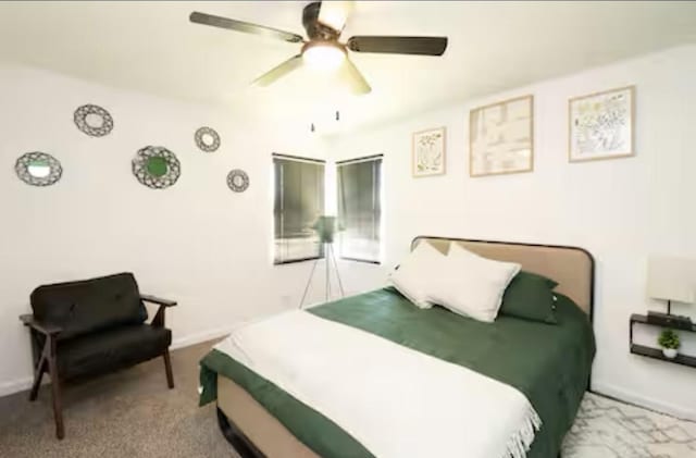 5920 Tourist Dr, North Richland Hills, TX 76117 - carpeted bedroom with ceiling fan and baseboards