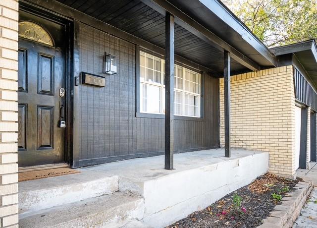 5920 Tourist Dr, North Richland Hills, TX 76117 - view of exterior entry featuring covered porch and brick siding