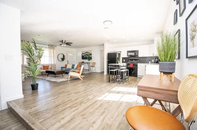 5920 Tourist Dr, North Richland Hills, TX 76117 - living room with light wood-style flooring and a ceiling fan