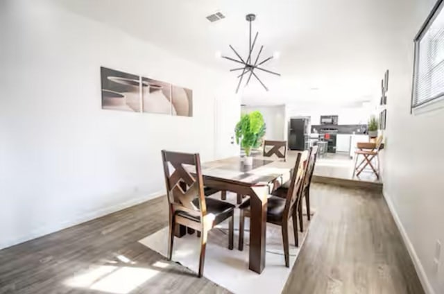 5920 Tourist Dr, North Richland Hills, TX 76117 - dining space featuring wood finished floors and baseboards